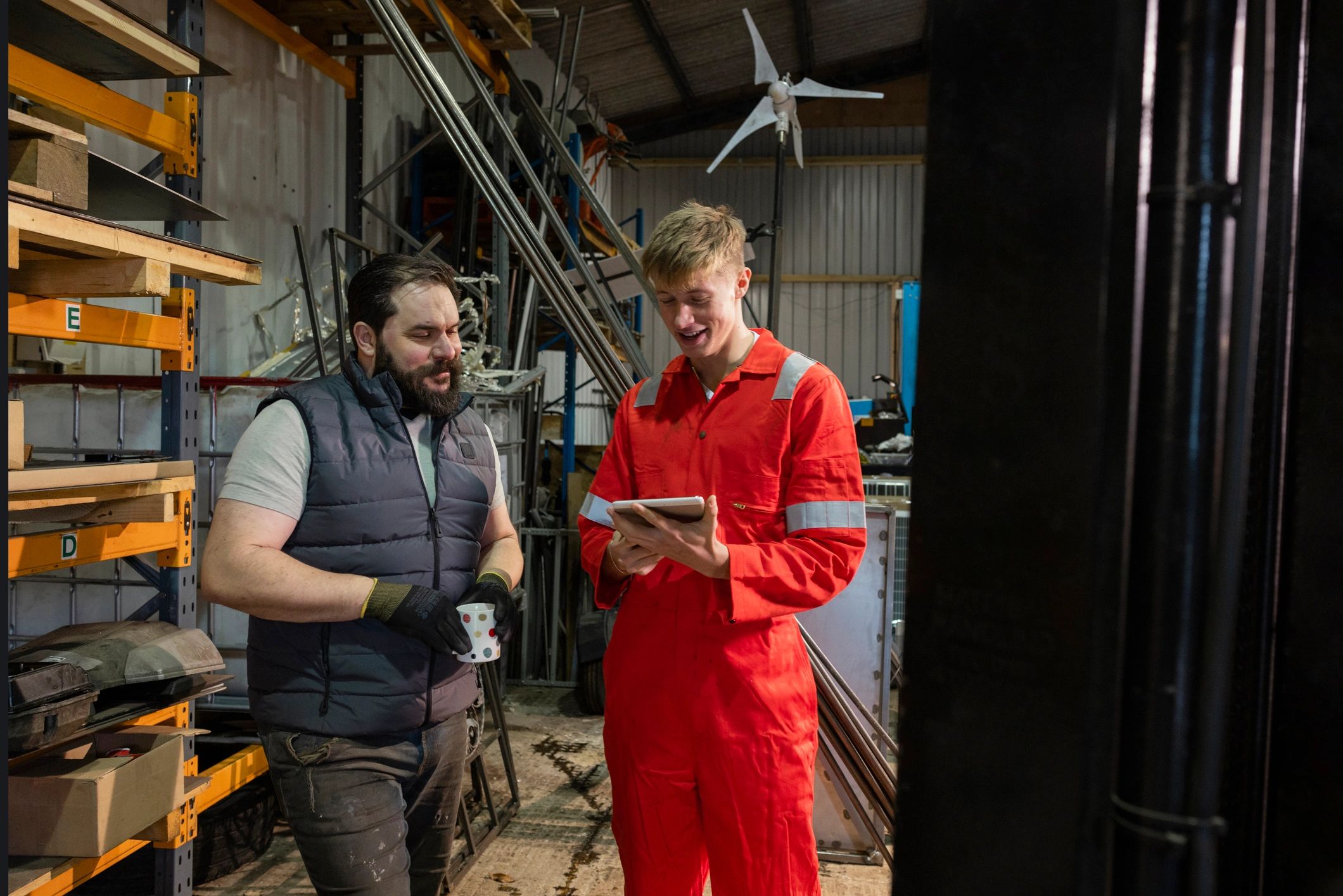 Warehouse team using a tablet to manage operations